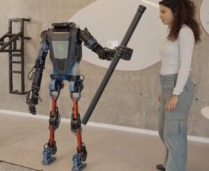 Representative image. Humanoid robot interacts with woman.