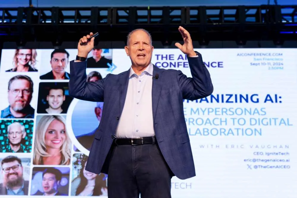 Eric Vaughan speaks on stage at The AI Conference; screen shows session details and his title; adjacent tweet highlights MyPersonas launch and delivery timeline