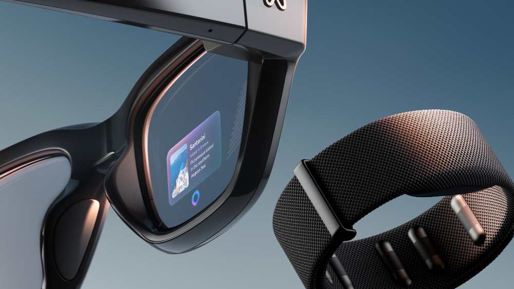 Close-up view of Meta Ray-Ban Display smart glasses showing the small color display in the right lens with a blue interface displaying Santorini travel information, positioned next to the black Neural Band wristband with textured surface.
