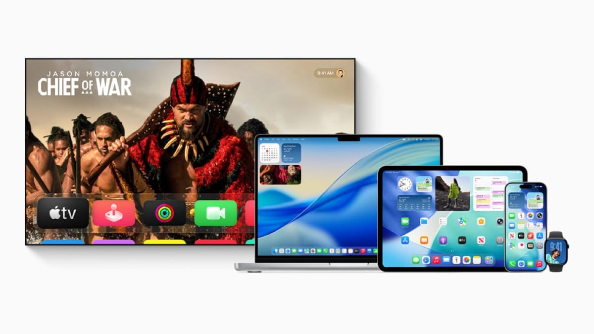 Various Apple devices displaying the new iOS 26 software with Liquid Glass design, featuring Apple TV showing the series "Chief of War" with Jason Momoa, alongside MacBook Pro, iPad Pro, and iPhone 17 Pro.
