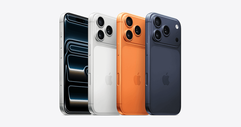 Four iPhone 17 Pro models displayed in a row showing different color variants - black, white, orange, and navy blue - featuring the dual camera system and edge-to-edge display.