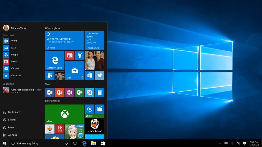 A screenshot of the Windows 10 desktop, showing the start menu with various applications and the classic Windows logo wallpaper.
