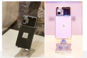 Two Honor Robot Phone prototypes displayed at China User Carnival showing black model with retracted gimbal camera on left and white pink model on display stand on right with visible camera island design