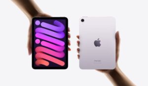 iPad mini device showing purple and blue finish options with edge-to-edge display design and rounded corners against white background