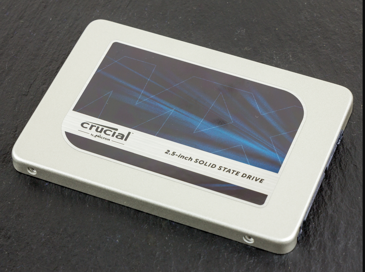 Crucial MX300 525GB SATA III solid-state drive with black casing and white Crucial branding label showing model number and technical specifications on top surface