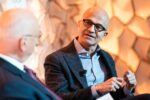 Microsoft CEO Satya Nadella speaking at World Economic Forum Annual Meeting addressing concerns about AI bubble risk and need for industry-wide technology diffusion