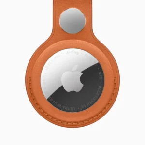 Apple AirTag attached to FineWoven Key Ring in multiple color options including fox orange, midnight purple, navy, moss, and black against white background