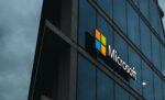 Glass panels exterior facade of Microsoft corporate building reflecting sky