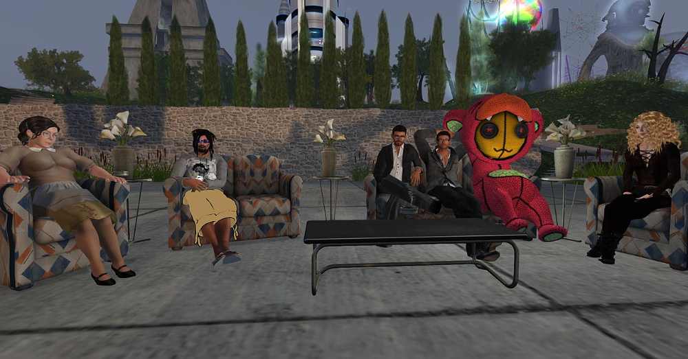 Avatars gathered at a live virtual event inside Second Life during its 11th Birthday celebration, with the Drax Files Radio Hour broadcast in progress on screen