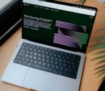 Open laptop on a desk representing the desktop interface at the centre of OpenAI's plan to merge ChatGPT, Codex, and Atlas into a single superapp