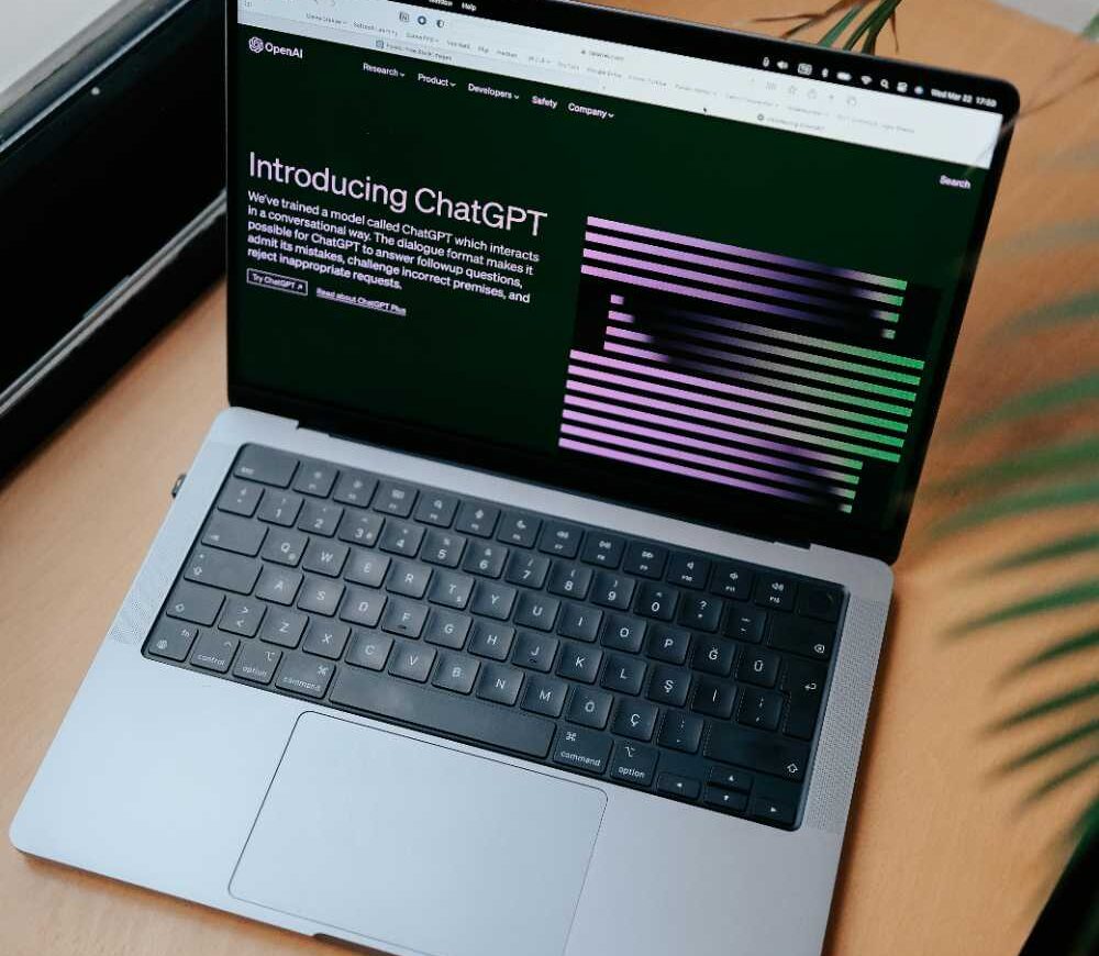 Open laptop on a desk representing the desktop interface at the centre of OpenAI's plan to merge ChatGPT, Codex, and Atlas into a single superapp