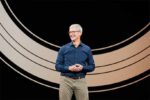 Tim Cook stands on stage at the Steve Jobs Theater during Apple's September 2018 keynote event at Apple Park in Cupertino, California