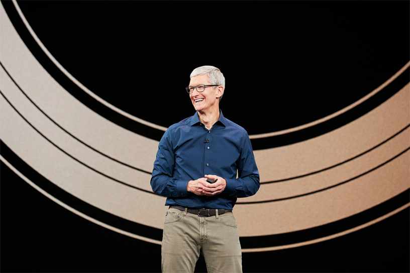 Tim Cook stands on stage at the Steve Jobs Theater during Apple's September 2018 keynote event at Apple Park in Cupertino, California