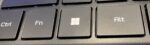 The Windows key on a keyboard built for Windows 11-compatible hardware, featuring the redesigned four-pane Windows 11 logo etched onto the key surface