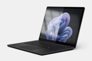 Microsoft Surface Laptop 6 for Business shown in a pivot angle view, featuring a slim aluminium chassis, 13.5-inch PixelSense anti-reflective touchscreen display, and a backlit keyboard, displayed against a clean studio background