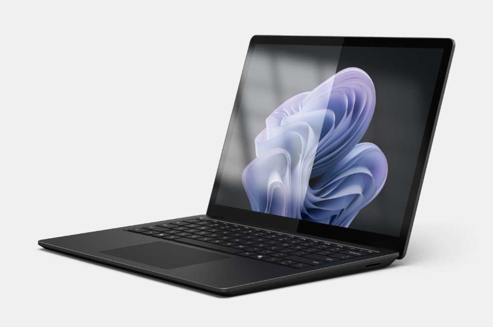 Microsoft Surface Laptop 6 for Business shown in a pivot angle view, featuring a slim aluminium chassis, 13.5-inch PixelSense anti-reflective touchscreen display, and a backlit keyboard, displayed against a clean studio background