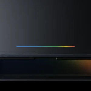 Close-up of the Googlebook Glowbar LED strip on the laptop lid, a hardware feature Google describes as functional and beautiful, required on all Googlebook models from Acer, ASUS, Dell, HP and Lenovo