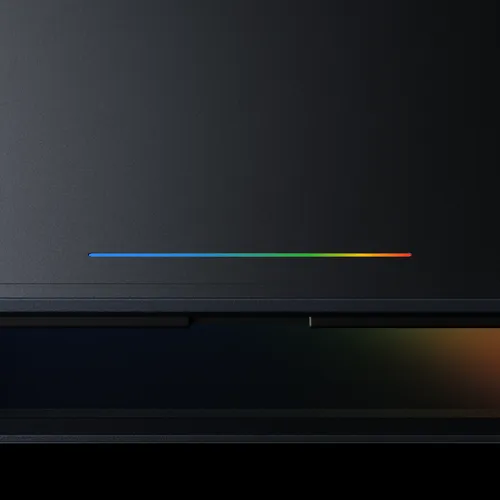 Close-up of the Googlebook Glowbar LED strip on the laptop lid, a hardware feature Google describes as functional and beautiful, required on all Googlebook models from Acer, ASUS, Dell, HP and Lenovo