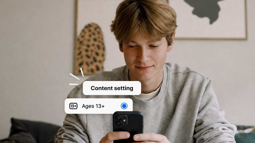 A teenage boy looking at his phone while Meta expands 13+ content settings for teen accounts globally on Instagram, Facebook and Messenger