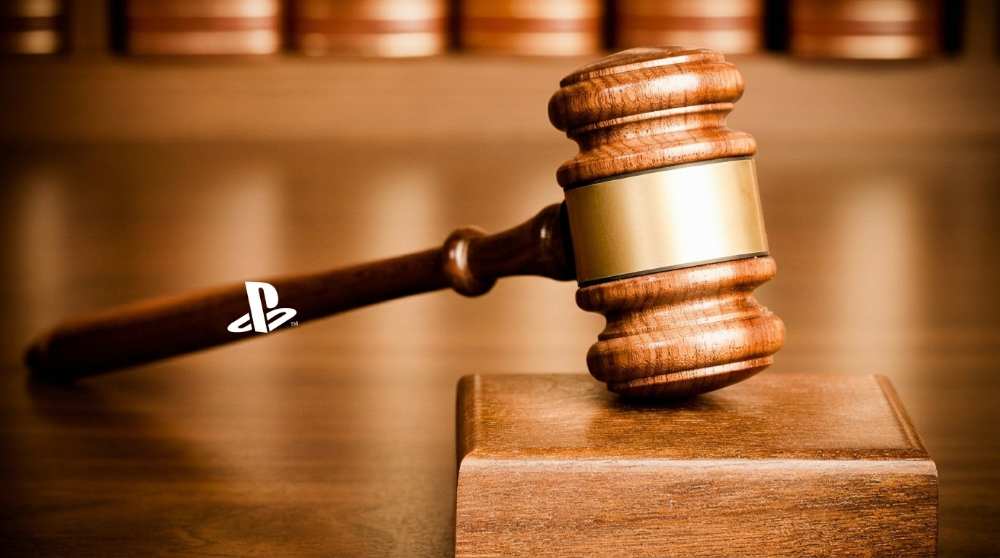A wooden courtroom gavel resting beside the PlayStation logo, symbolizing the legal pressure facing Sony's digital storefront