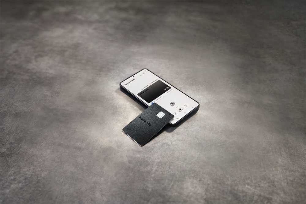 Samsung Galaxy Card displayed next to Samsung Wallet interface on a smartphone screen, showing the black metal credit card and the digital wallet integration