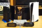 Multiple PlayStation console generations displayed together including PS1, PS2, PS3, PS4, PS5, PSP, and PS Vita